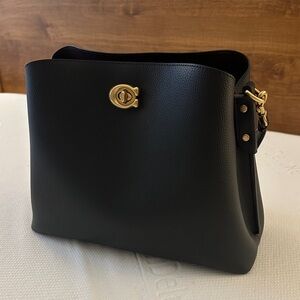 Coach Black Leather Shoulder Bag with Gold Accents